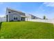 Backyard with white picket fence, green grass, and covered patio at 6830 Park Grove Blvd, Whitestown, IN 46075