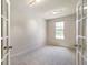 Bright bedroom with neutral carpet, recessed lighting, and a large window for natural light at 6830 Park Grove Blvd, Whitestown, IN 46075