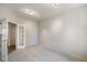 Well-lit bedroom with neutral carpet, recessed lights, and glass paneled doors to hallway at 6830 Park Grove Blvd, Whitestown, IN 46075
