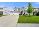 Beautiful two-story home with a three car garage, dormer windows, well maintained lawn, and welcoming curb appeal at 6830 Park Grove Blvd, Whitestown, IN 46075