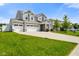 Beautifully maintained two-story home with three-car garage, manicured front lawn, and lovely curb appeal in a friendly neighborhood at 6830 Park Grove Blvd, Whitestown, IN 46075