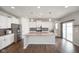 Bright eat-in kitchen featuring stainless steel appliances, a center island with granite countertops and wooden floors at 6830 Park Grove Blvd, Whitestown, IN 46075
