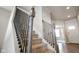 Carpeted staircase with wrought iron spindles at 6830 Park Grove Blvd, Whitestown, IN 46075