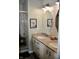 Bathroom featuring double vanity, granite countertops, and framed animal art at 6862 Riverside Way, Fishers, IN 46038
