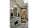 Bathroom featuring a dual sink vanity and a walk-in shower at 6862 Riverside Way, Fishers, IN 46038