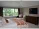 Bedroom featuring large windows with natural light, and comfortable seating area at 6862 Riverside Way, Fishers, IN 46038