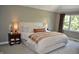Bedroom with plush carpeting, a large bed and bedside tables at 6862 Riverside Way, Fishers, IN 46038