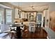 Bright kitchen with white cabinets, granite countertops, and stainless steel appliances at 6862 Riverside Way, Fishers, IN 46038