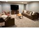 Spacious living room with plush seating, a flat-screen TV, and ample gathering space at 6862 Riverside Way, Fishers, IN 46038