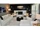 Stylish living room with a cozy fireplace, white sofas, and contemporary decor at 6862 Riverside Way, Fishers, IN 46038