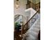 Elegant foyer showcasing a staircase, dark wood floors, and decorative mirror at 6862 Riverside Way, Fishers, IN 46038