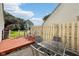 Backyard featuring a patio with outdoor seating, grassy lawn, and partial fence at 69 Stoneybrook Dr, Greenwood, IN 46142