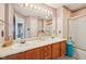 Bathroom featuring double sinks, large mirror, and bathtub/shower with sliding glass door at 69 Stoneybrook Dr, Greenwood, IN 46142