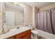 Bathroom featuring a single vanity, large mirror, shower with curtain, and linen closet at 69 Stoneybrook Dr, Greenwood, IN 46142