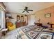 Spacious bedroom featuring vintage wallpaper, floral curtains, and comfortable furniture at 69 Stoneybrook Dr, Greenwood, IN 46142