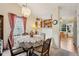 Charming dining room with a round table, patterned chairs, and a view into the breakfast nook at 69 Stoneybrook Dr, Greenwood, IN 46142
