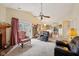 Comfortable living room with a fireplace, leather recliners, and sliding glass doors to the outside at 69 Stoneybrook Dr, Greenwood, IN 46142
