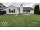 This is a view of the backyard and back exterior of the home at 7022 Cordova Dr, Indianapolis, IN 46221