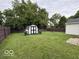 This is a view of the backyard featuring a utility shed at 7022 Cordova Dr, Indianapolis, IN 46221