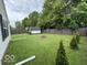 This backyard has a firepit and green space for outdoor enjoyment at 7022 Cordova Dr, Indianapolis, IN 46221