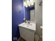 A full bathroom with a white vanity, lighting, and fixtures at 7022 Cordova Dr, Indianapolis, IN 46221