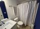 A full bathroom with a gray and white patterned shower curtain at 7022 Cordova Dr, Indianapolis, IN 46221