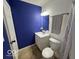 A full bathroom with a white vanity and tiling at 7022 Cordova Dr, Indianapolis, IN 46221