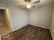 A bedroom featuring a window and wood flooring at 7022 Cordova Dr, Indianapolis, IN 46221