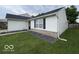A charming home with a well-maintained lawn and simple, attractive landscaping at 7022 Cordova Dr, Indianapolis, IN 46221