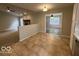 Open-concept kitchen with tile flooring connecting to the living spaces of the home at 7022 Cordova Dr, Indianapolis, IN 46221