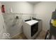 This is a laundry room with a washer and dryer and storage shelf at 7022 Cordova Dr, Indianapolis, IN 46221