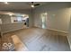 Open floor plan featuring living room with plush carpet and kitchen with stainless steel appliances at 7022 Cordova Dr, Indianapolis, IN 46221