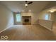 A large living room with a brick fireplace at 7022 Cordova Dr, Indianapolis, IN 46221