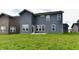 Back exterior view of a two-story house with a lawn at 7147 Buckley Branch Dr, Indianapolis, IN 46259