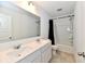 Bright bathroom features double sink vanity and shower over tub at 7147 Buckley Branch Dr, Indianapolis, IN 46259