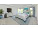 Bright bedroom features calming decor, beach-themed art and a large window at 7147 Buckley Branch Dr, Indianapolis, IN 46259