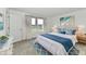 Cozy bedroom with a soft white bed, blue accents, and light wood nightstands at 7147 Buckley Branch Dr, Indianapolis, IN 46259
