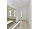 Bright entryway with neutral flooring leads to a carpeted living space with ample natural light at 7147 Buckley Branch Dr, Indianapolis, IN 46259
