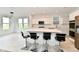 Open kitchen with quartz countertops, an island with seating, and stainless steel appliances at 7147 Buckley Branch Dr, Indianapolis, IN 46259