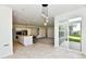 Spacious kitchen with stainless steel appliances, white countertops, and an eat-in island at 7147 Buckley Branch Dr, Indianapolis, IN 46259