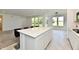 Kitchen featuring a white quartz countertop island with seating, and stainless steel appliances at 7147 Buckley Branch Dr, Indianapolis, IN 46259