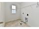 Bright laundry room with tile flooring and window at 7147 Buckley Branch Dr, Indianapolis, IN 46259