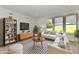 Modern living room featuring a white sofa set, contemporary furniture, and a large flat-screen TV at 7147 Buckley Branch Dr, Indianapolis, IN 46259