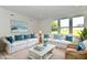 Bright living room features cozy seating and natural light at 7147 Buckley Branch Dr, Indianapolis, IN 46259
