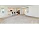 Open floorplan with a kitchen island, white cabinets, stainless steel appliances, and carpet flooring at 7147 Buckley Branch Dr, Indianapolis, IN 46259