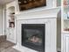 Elegant fireplace with marble surround and built-in shelving, perfect for cozy evenings at 7184 Lillian Pl, Cumberland, IN 46229