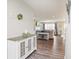 The wide hallway offers a console table, luxury vinyl plank, and lots of bright, natural light at 7184 Lillian Pl, Cumberland, IN 46229