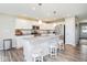 Bright, modern kitchen with granite countertops, stainless appliances, and a center island at 7184 Lillian Pl, Cumberland, IN 46229