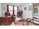 Cozy living room with an armchair, side tables, a large window, and a decorative area rug at 7184 Lillian Pl, Cumberland, IN 46229