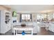 Open-concept living room features hardwood floors, fireplace, and access to dining area, creating an inviting space at 7184 Lillian Pl, Cumberland, IN 46229